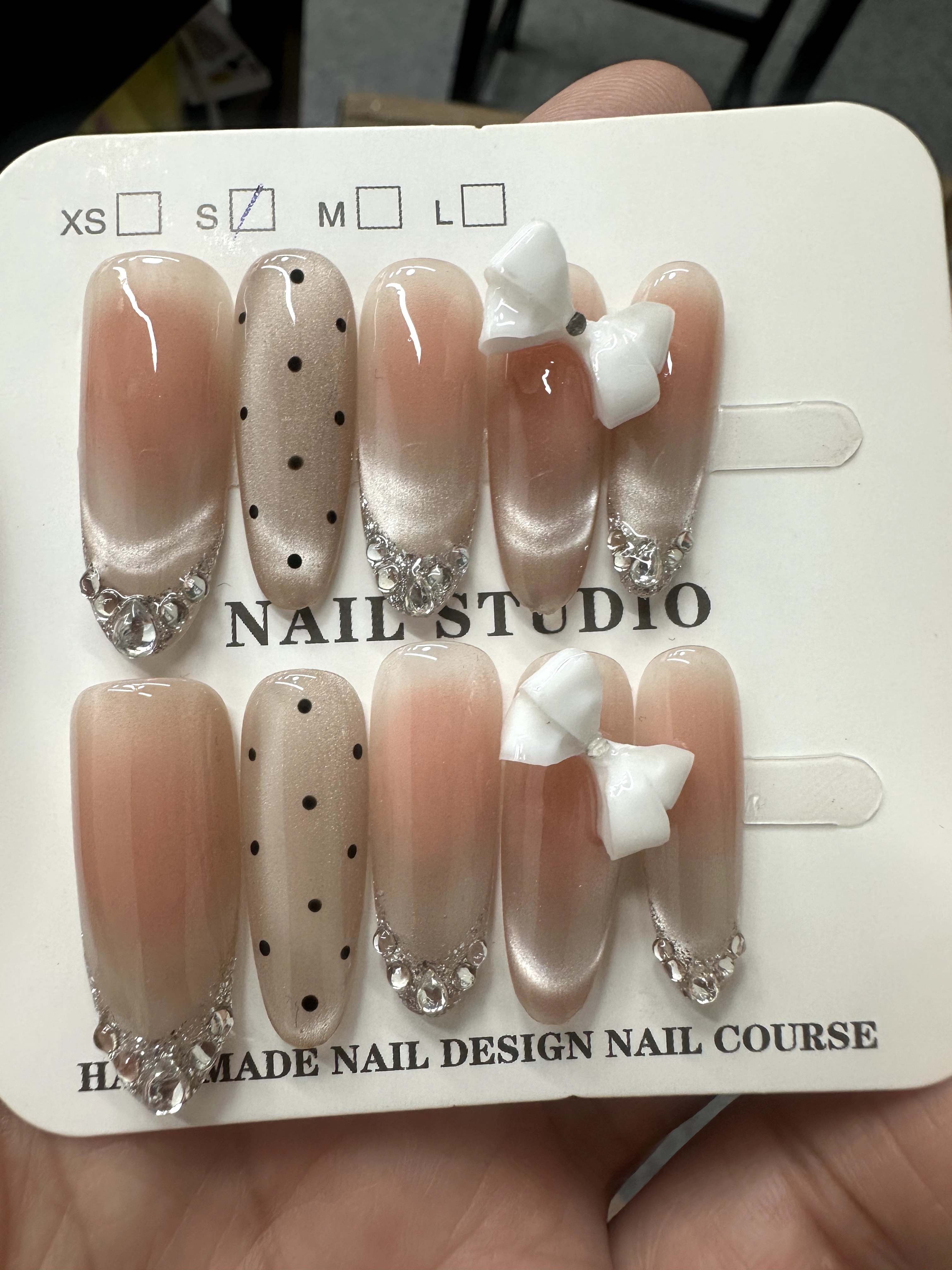 Nude bow and crystal press-on nails